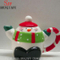 Weihnachtskeramik-Schneemann-Teekanne mit grünem Schal auf Deckel