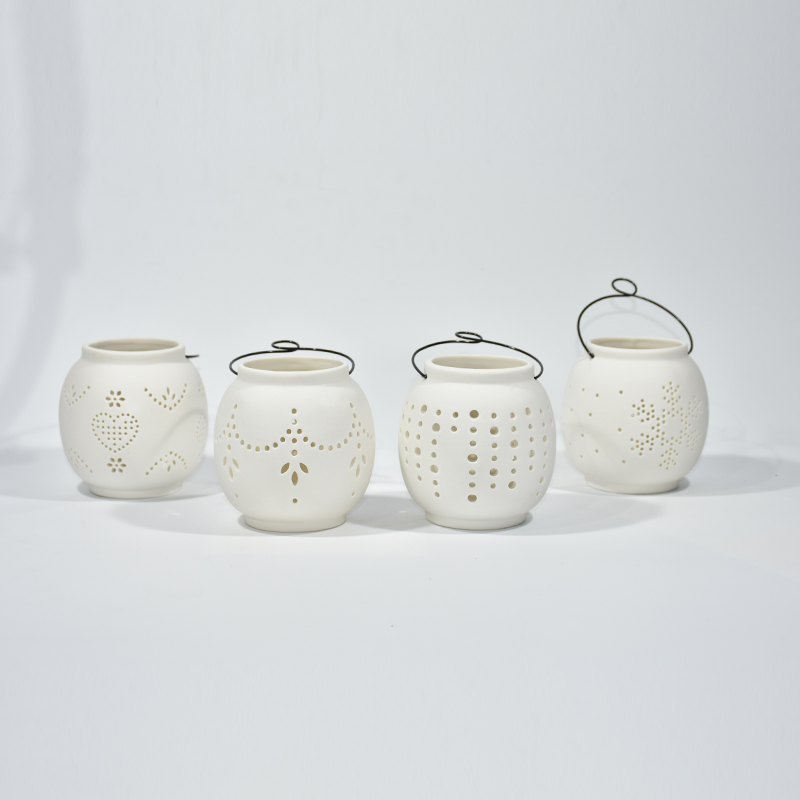 Tragbares weißes Porzellan kreisförmiger Hohlkerzenbecher Keramikmuster Hohlkernkeramikkerkerhalter