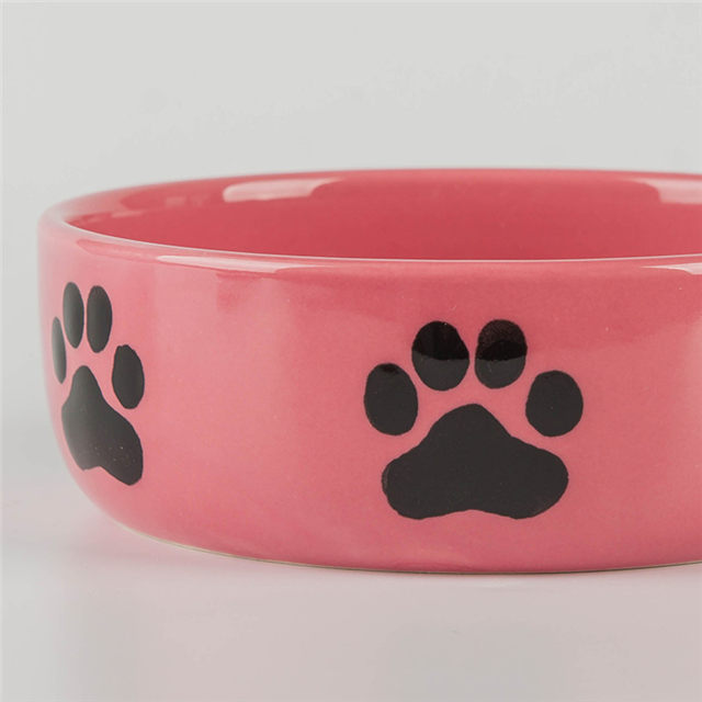 mit Hundefußabdrücken Drucken von kreisförmig bedruckten Knochen an der Schüssel Boden Keramik Hundefutter Rosa Keramik Tierfutter Pink Keramik Hundenapf
